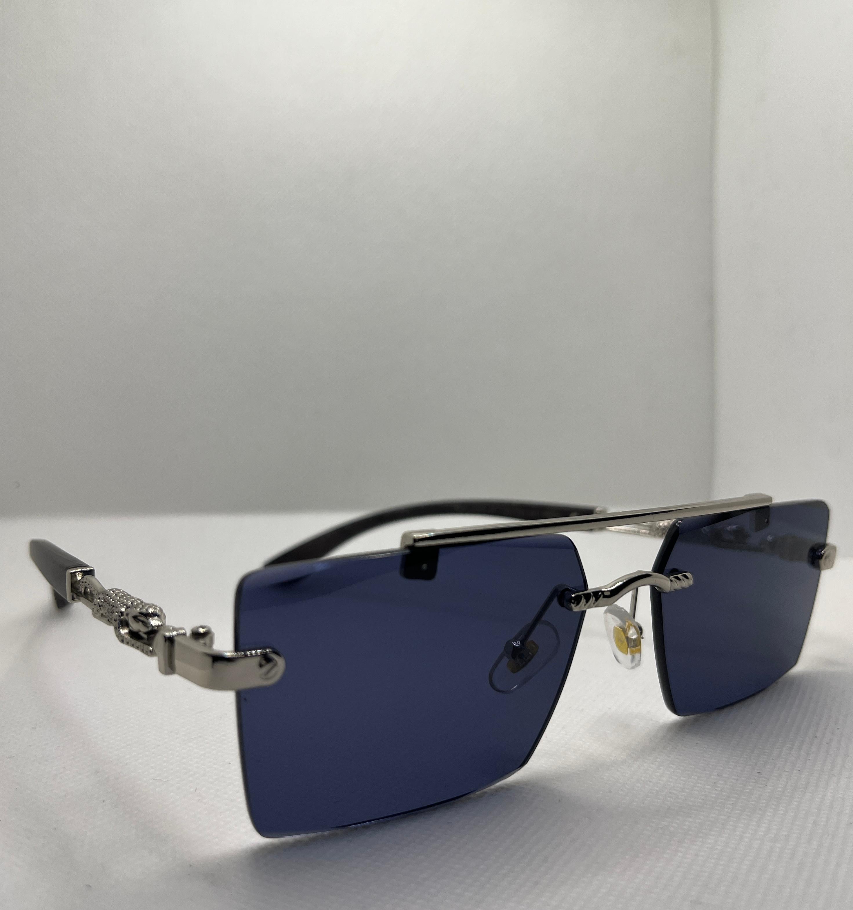  Meeran panther  sunglasses with blue lenses and a black/silver frame, featuring UV protection